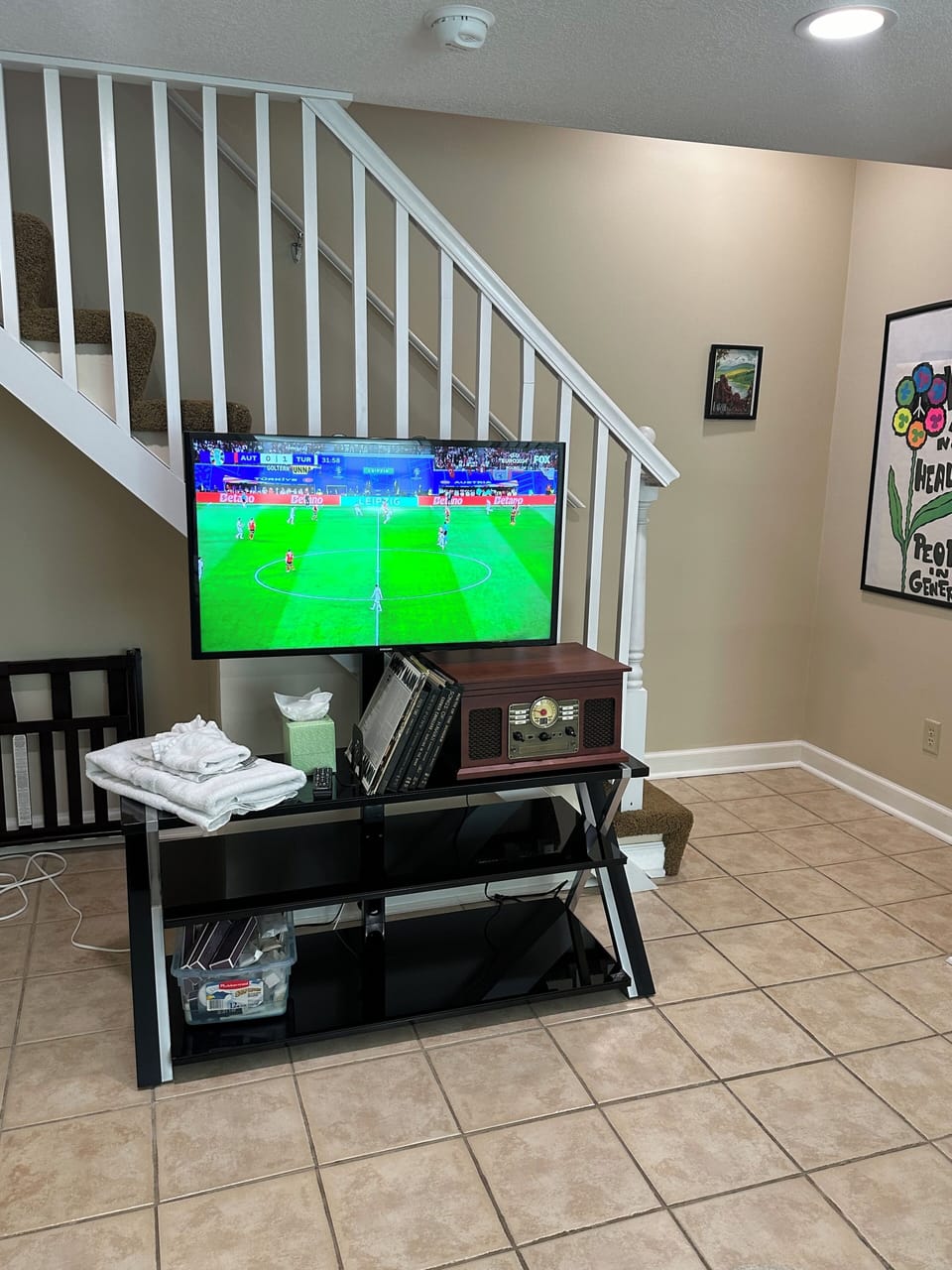 Smart screen w/YouTube TV, extra toiletries, record player and vintage records.