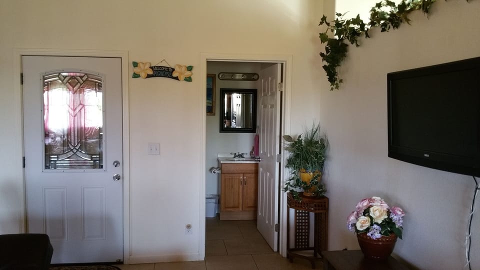 2nd floor- Portion of living room w/ convenient 1/2 bathroom close by.