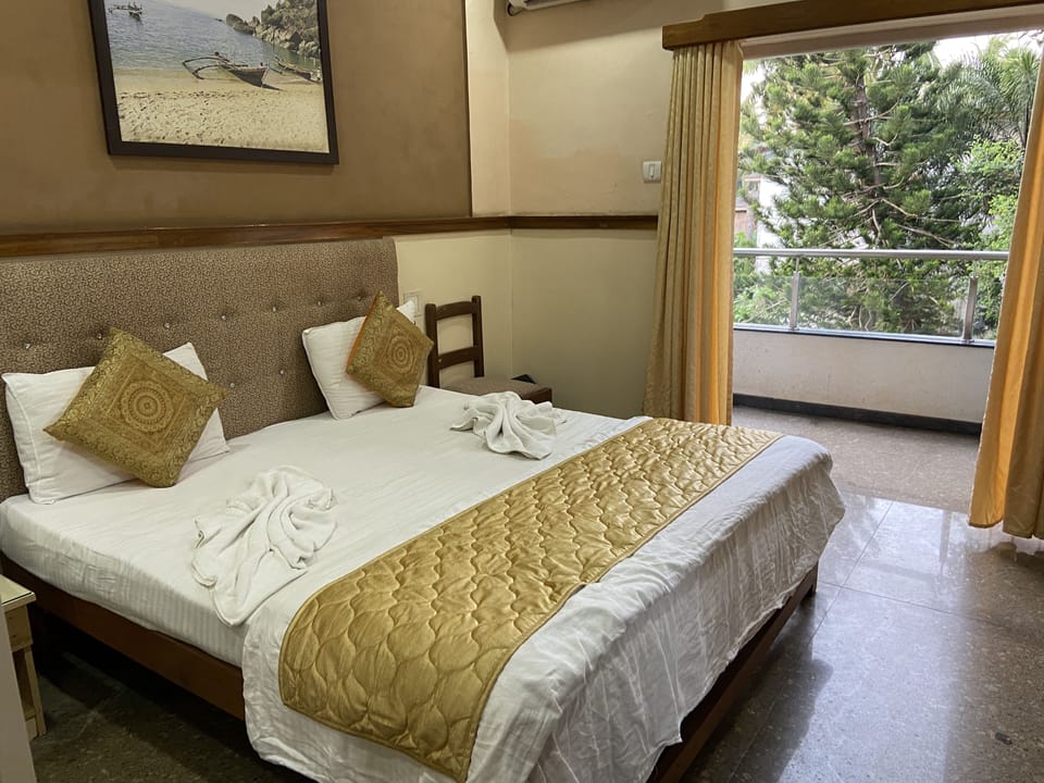 Deluxe Room with Balcony | In-room safe, desk, blackout drapes, free WiFi