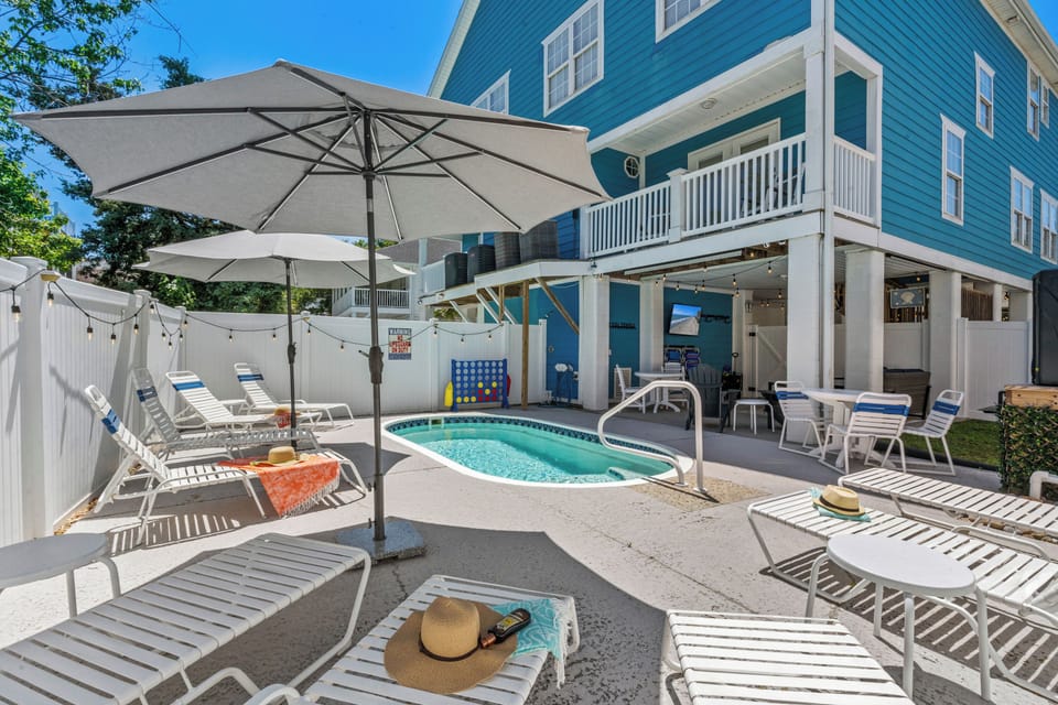 Pool area with plenty of seating and shade if wanted.