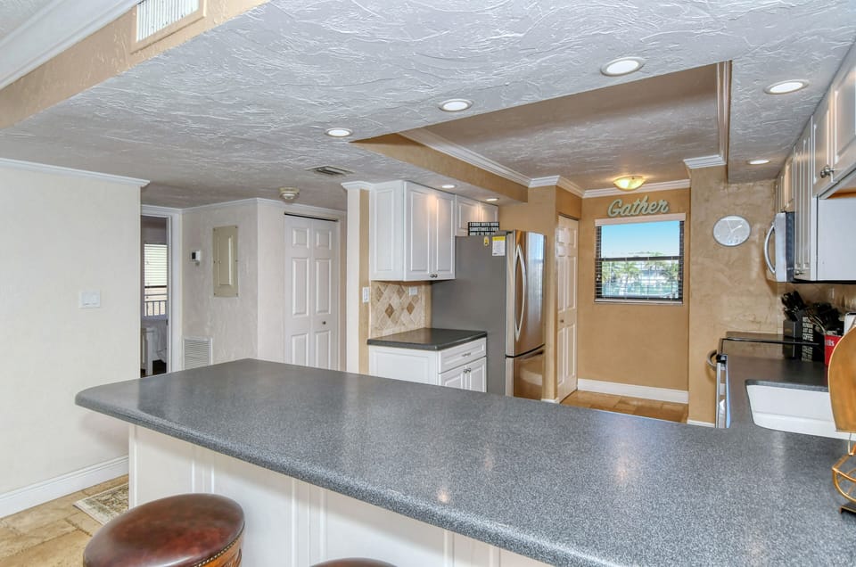 Modern updated kitchen granite counter tops, tile backsplash,  and all stainless steel appliances