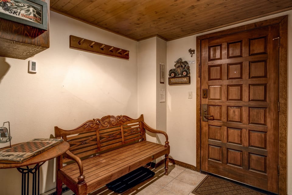 Entry area with Bench, Coat Closet, Coat Racks, and Cubbies for your mittens and such
