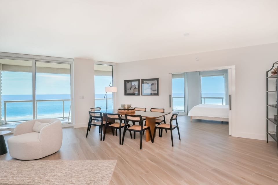 Step into your sun-filled retreat where panoramic ocean views greet you through floor-to-ceiling windows, inviting you to unwind in a space where comfort and coastal beauty meet.