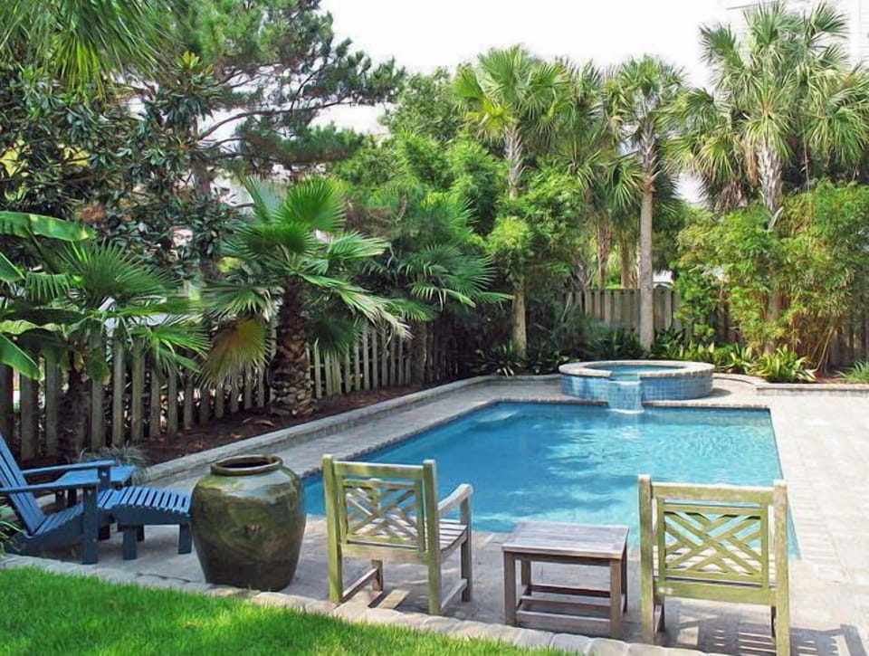 Fenced in yard with pool and spa