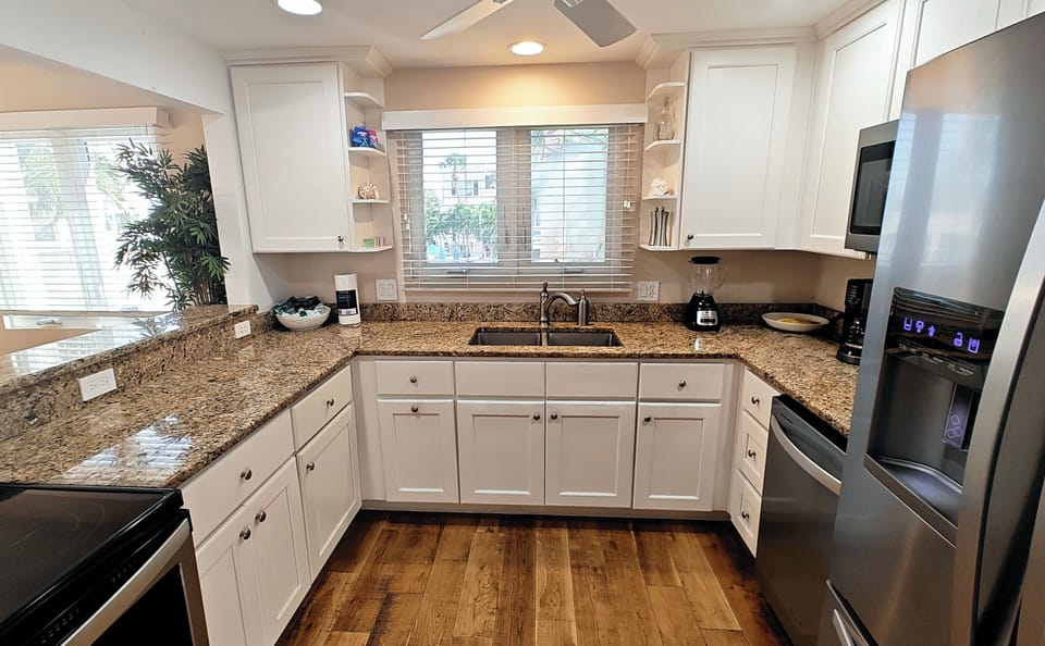 Stylish kitchen with granite countertops and stainless steel appliances