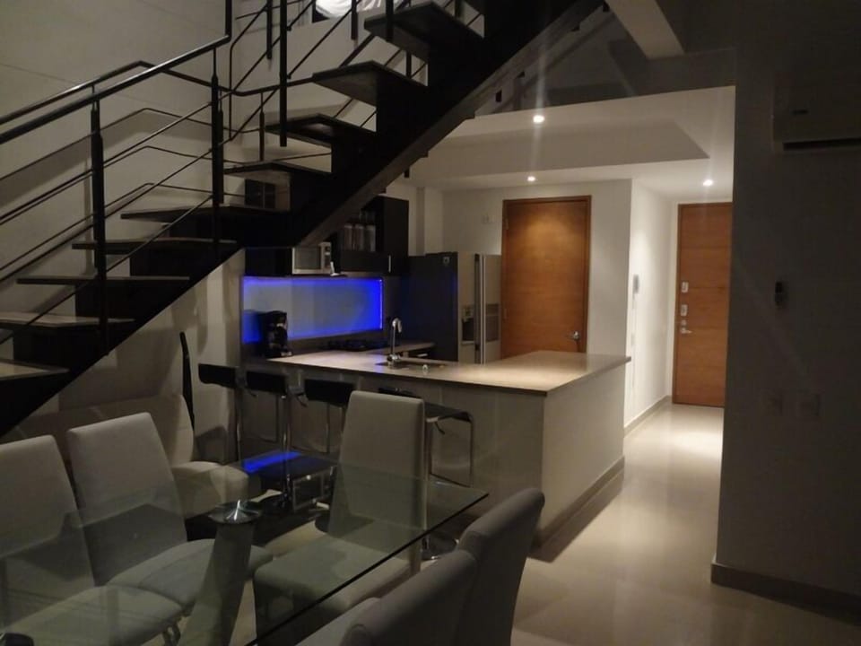 large modern dining for 8 overlooking the beach.