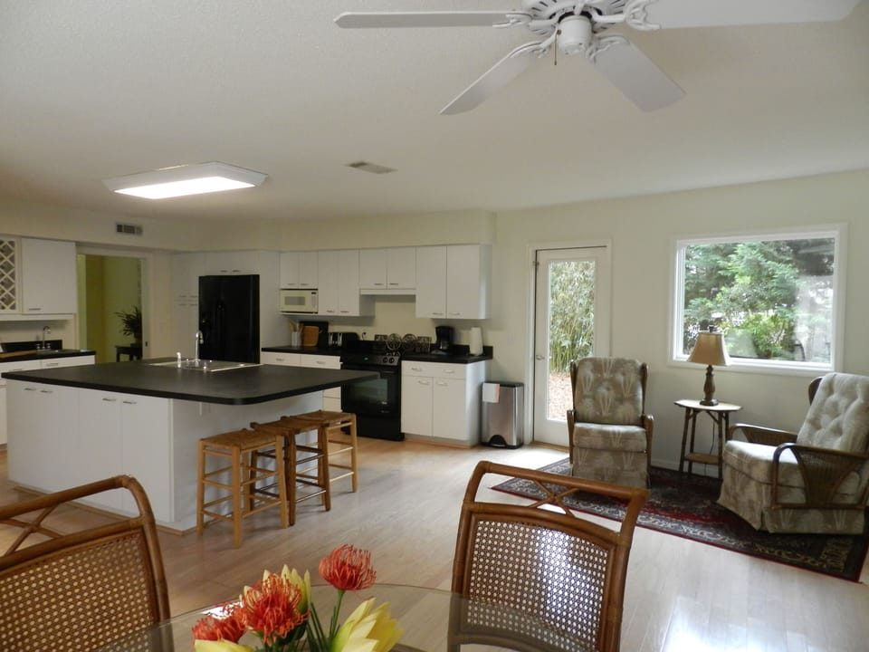 Kitchen sitting area, to the right back stairs lead to games room.
