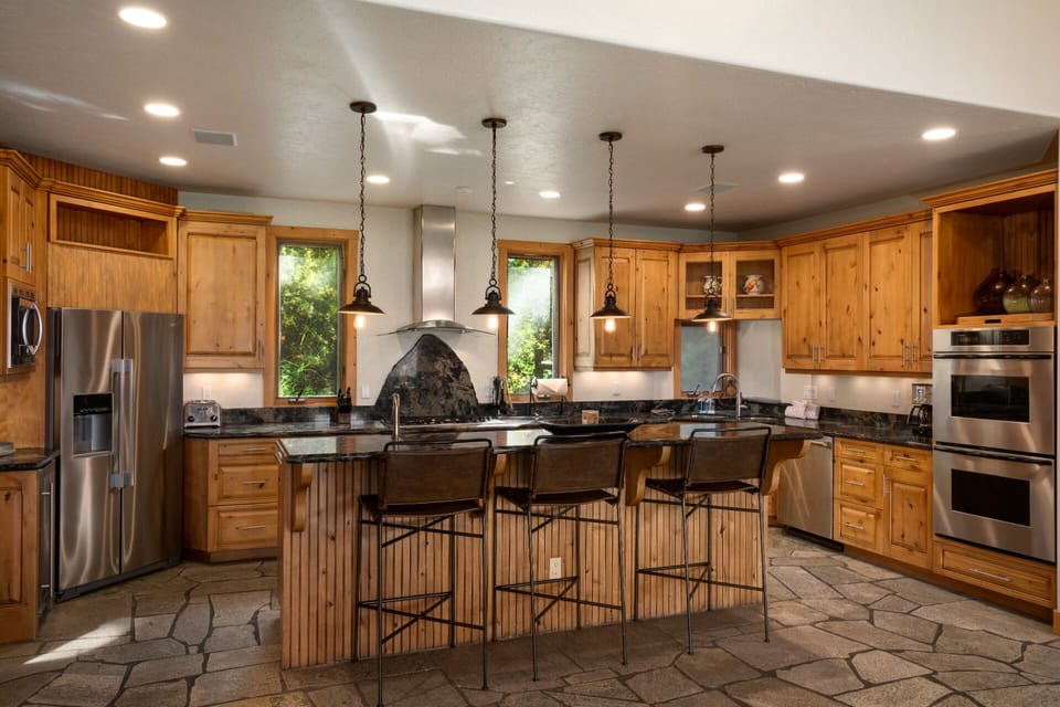 Gourmet Kitchen with Granite Counters & Wine Fridge