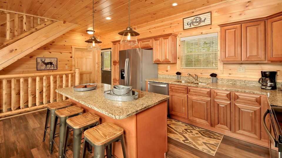 Well-stocked kitchen w/stainless-steel appliances, granite counter tops, pantry