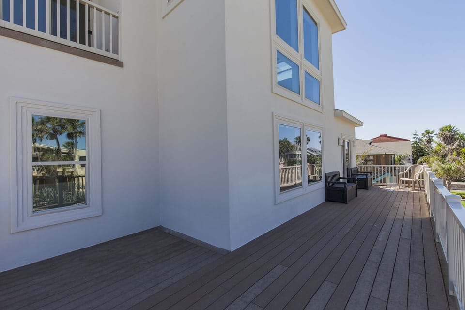 Large second-floor terrance offering plenty of space to relax in the coastal breeze.