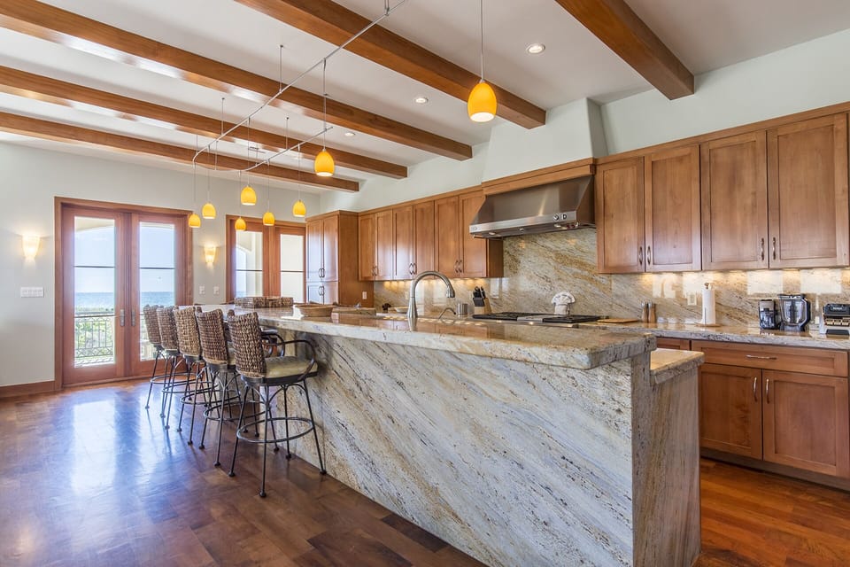This kitchen is enormous! It is fully stocked with all cooking supplies! Plenty of seating!
