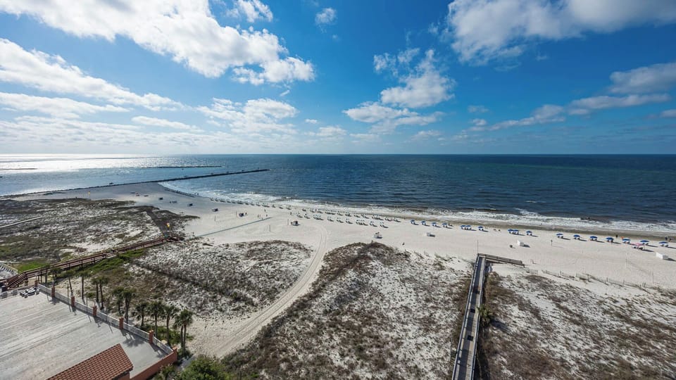 Gaze at the inviting shoreline and enjoy the tranquil waters, perfect for relaxation and beachside fun