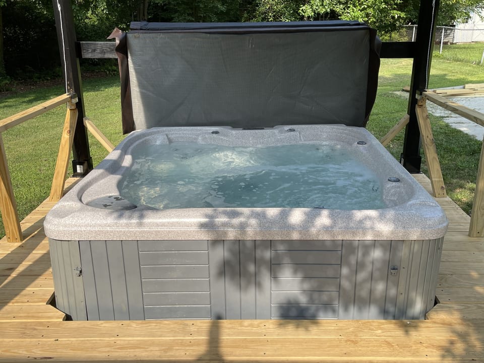 Private hot tub in back yard is a nice place to relax