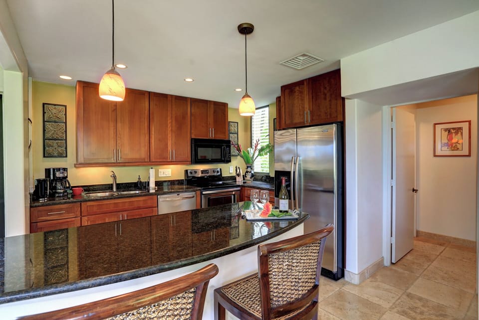 Fully equiped updated kitchen with granite counters, stainless appliances.