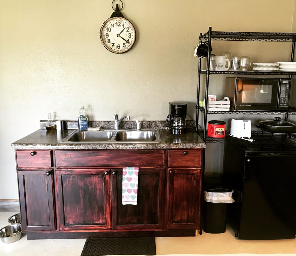 Microwave, toaster, coffeemaker, electric skillet, dishes and utensils provided.