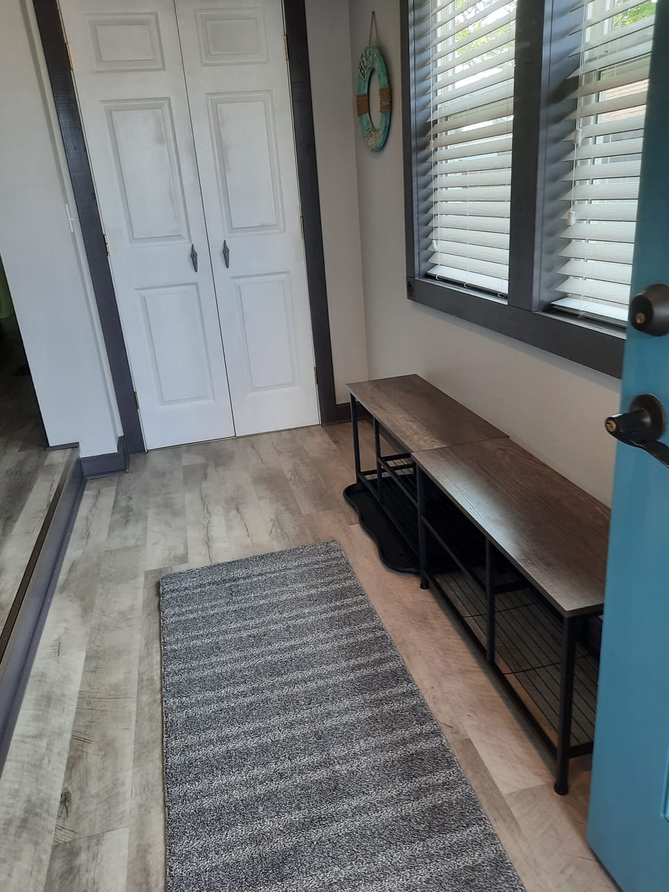 Foyer as you walk in shoe bench area