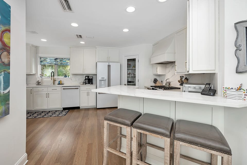 A breakfast bar provides even more seating for dining.