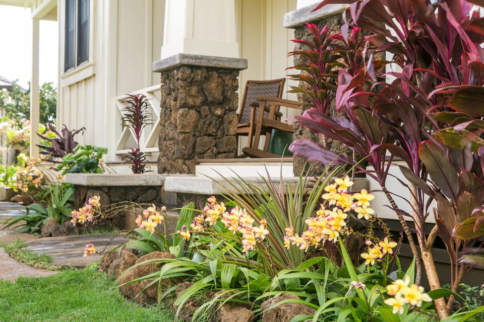 Lava rock entrance to Poipu Beach Estates Vacation Rental