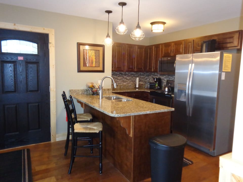 Updated Kitchen with Stainless Steel Appliances and granite counter tops