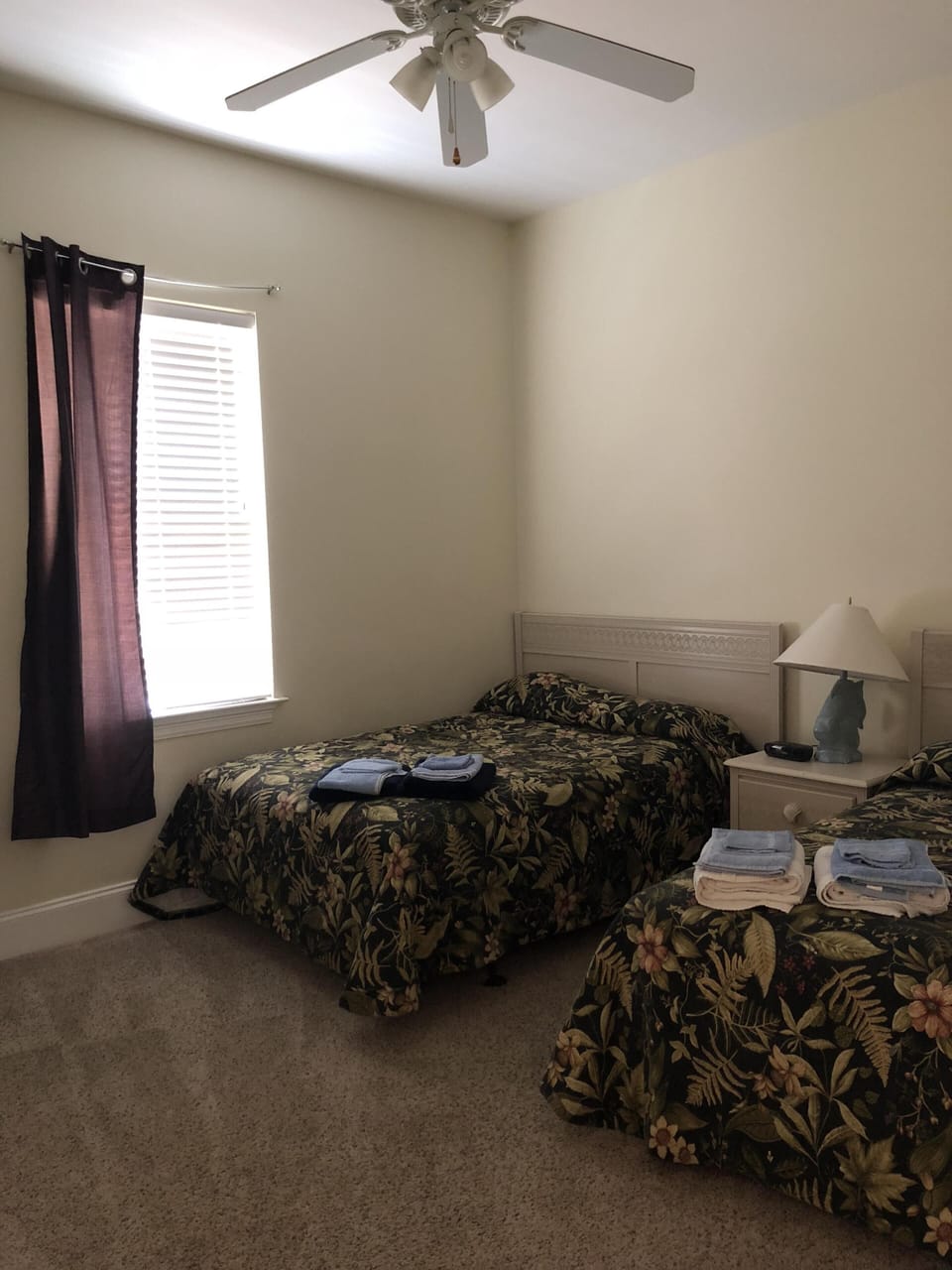 Bedroom #3 with two full beds, TV and bathroom.