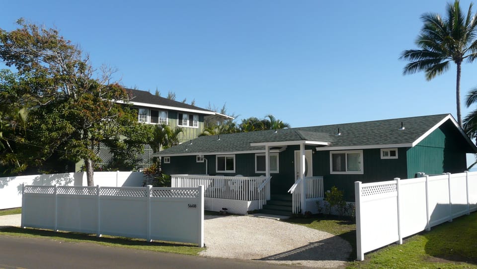 Front entrance with circular driveway, lanai and full privacy.