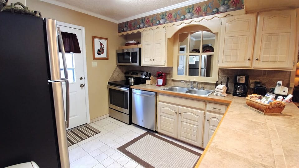 Your kitchen awaits with full-size appliances, plenty of counter space, and everything you need to prepare your favorite meals during your stay.
