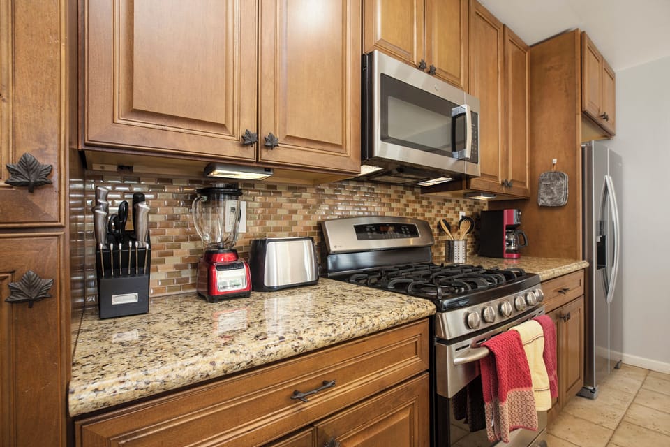 Kitchen with top of the line appliances and cooking utensils. Permit #str21-1275