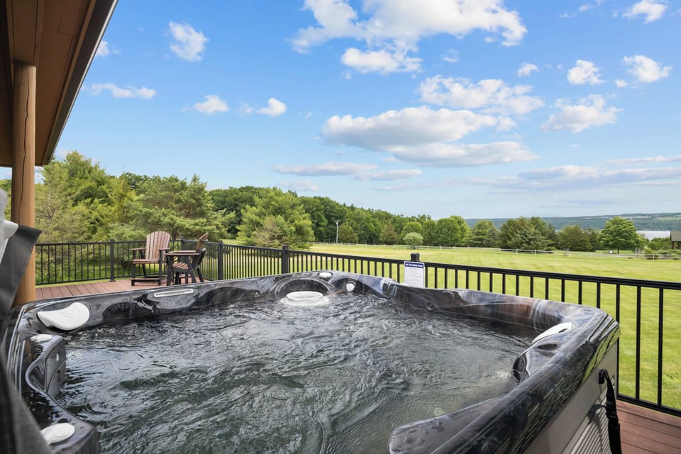 View of the yard and lake from the hot tub