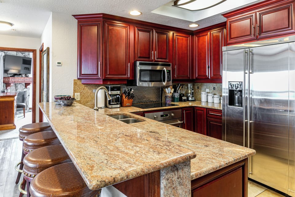 Gourmet kitchen with many appliances - dishes and silverware to serve 40