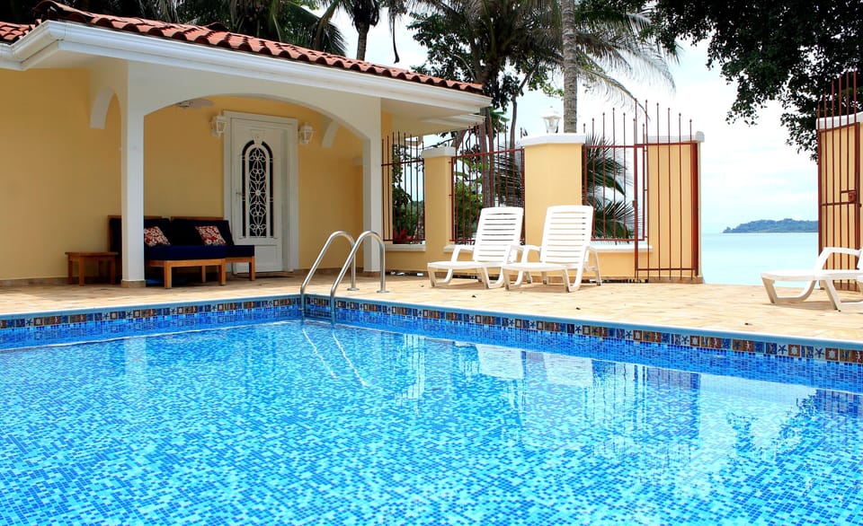Looking across the pool at SUITE CRICO of Las Casitas. Enjoy the sun or shade!