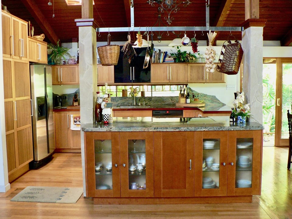 Modern kitchen with marble counters.