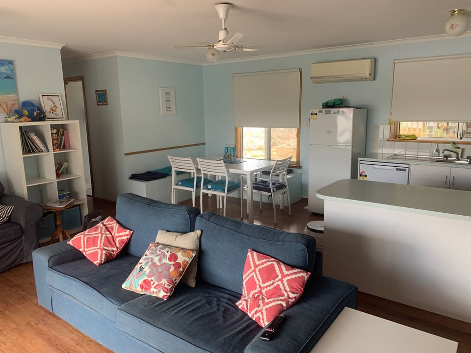 OPEN PLAN LIVINGS WITH  2 COUCHES & LARGE OUTDOOR DECK