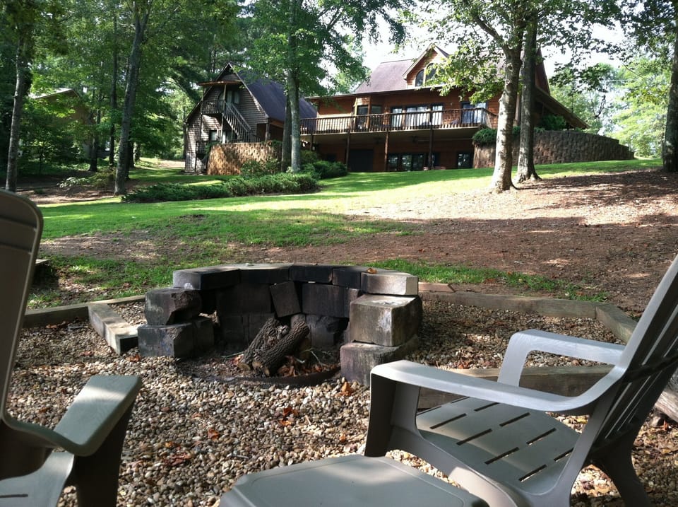 View from Fire Pit back to house.   Bldg. on left is detached garage (not incl).