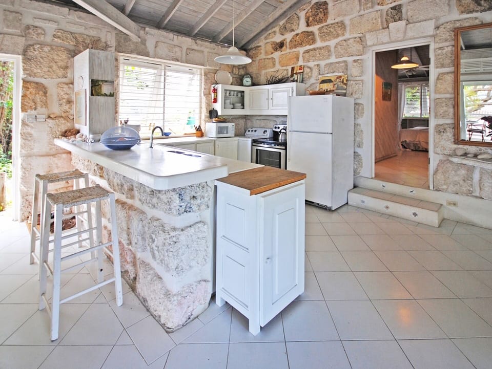 The kitchens breakfast bar is a lovely spot to sit and enjoy a coffee