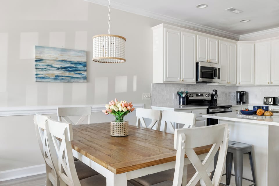 Dining table with seating for six to enjoy a meal together.