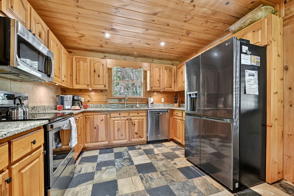 Cook with ease in the gourmet kitchen of this 3 bedroom cabin rental in the Georgia mountains, with stainless appliances and granite counters
