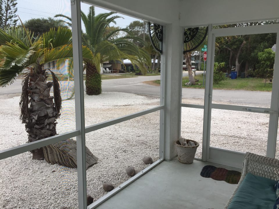 View out front screened in porch. 
Front & back patio are both screened in. 