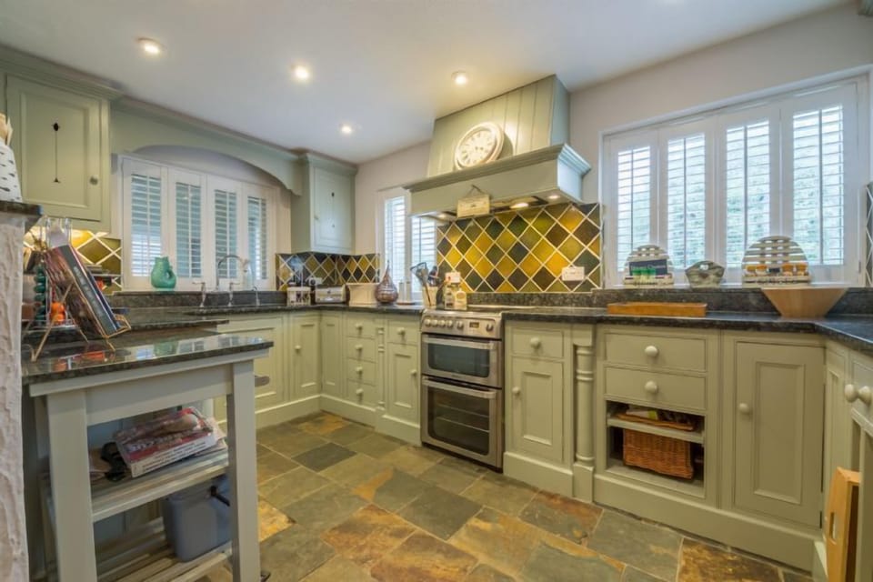 Kitchen with hand painted cupboards and granite worktops