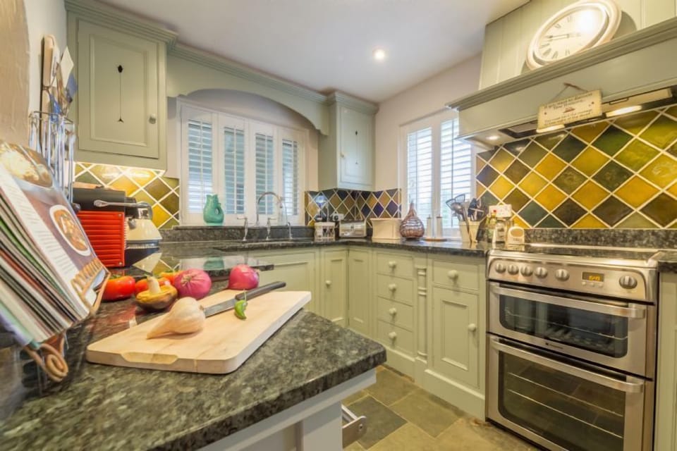Kitchen with electric oven and gas hob