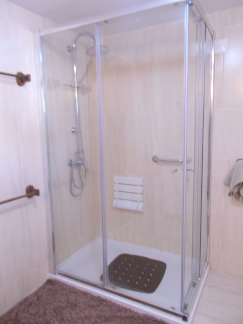 Ground floor bathroom with large shower cubicle.