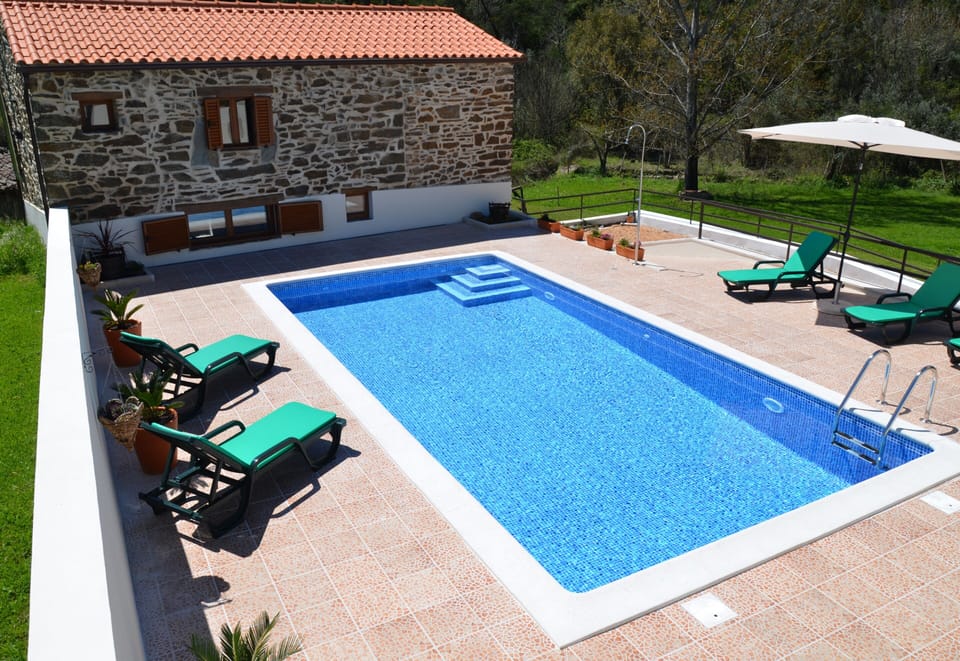 Your exclusive pool leading down a gentle slope to the  meadow 