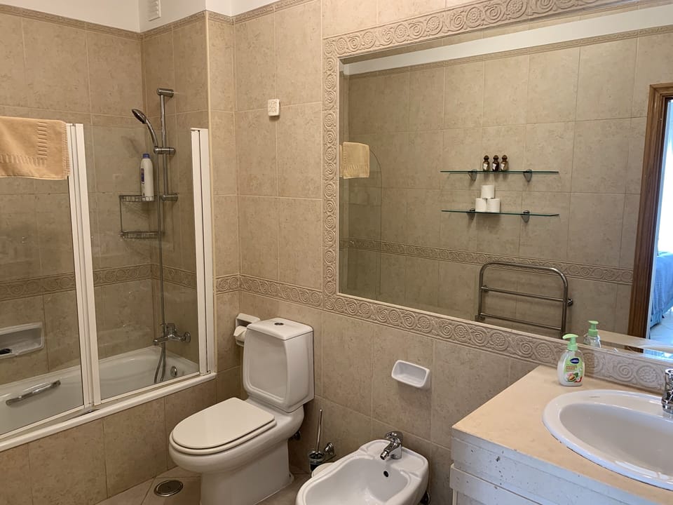 Large bathroom with shower, and there is a separate shower room too.