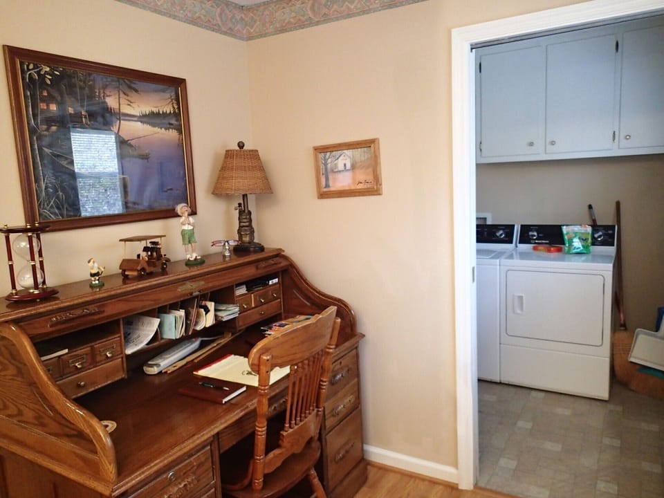 Desk and laundry room off of den area.
