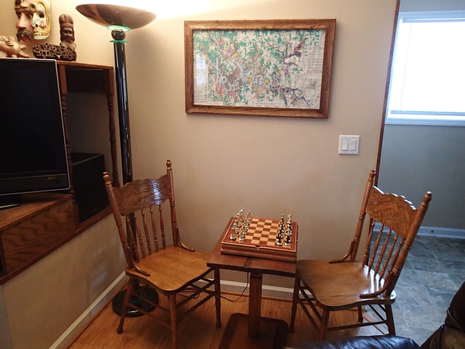 Chess and domino table in den. 