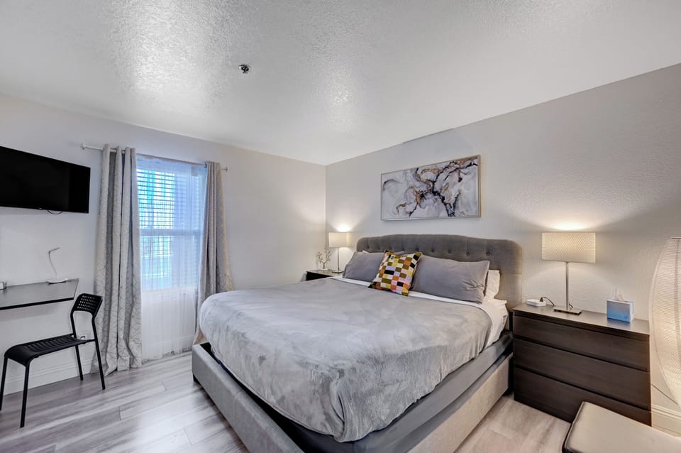 Master bedroom with 1 king size bed and walk-in closet, make up desk. 