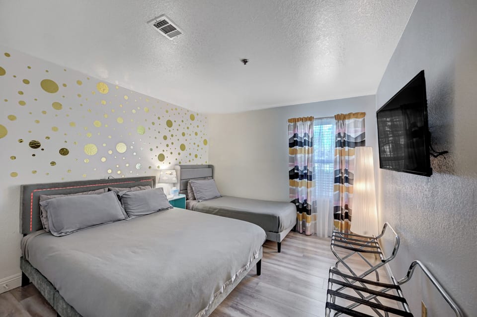 Guest bedroom with a queen bed and  an extra long twin bed