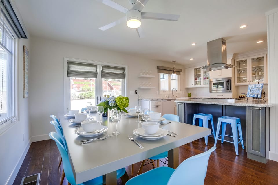 Dining room table opens into kitchen and living room.