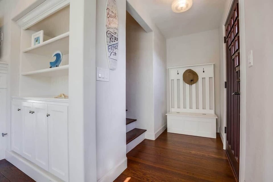 Front entrance leading into living room and upstairs.