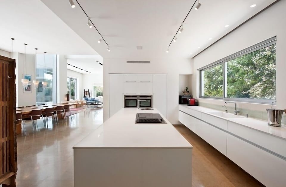 View from state of the art kitchen with floating units through multiple spaces