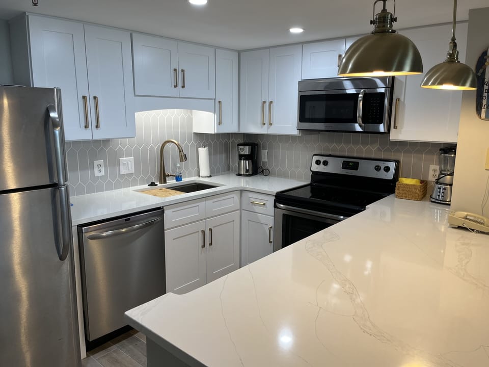 Champagne bronze finishes and a workstation stainless sink. 
